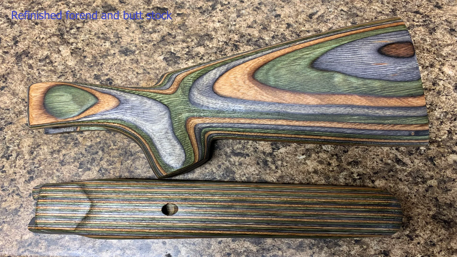 A piece of wood with a colorful pattern is sitting on a table.