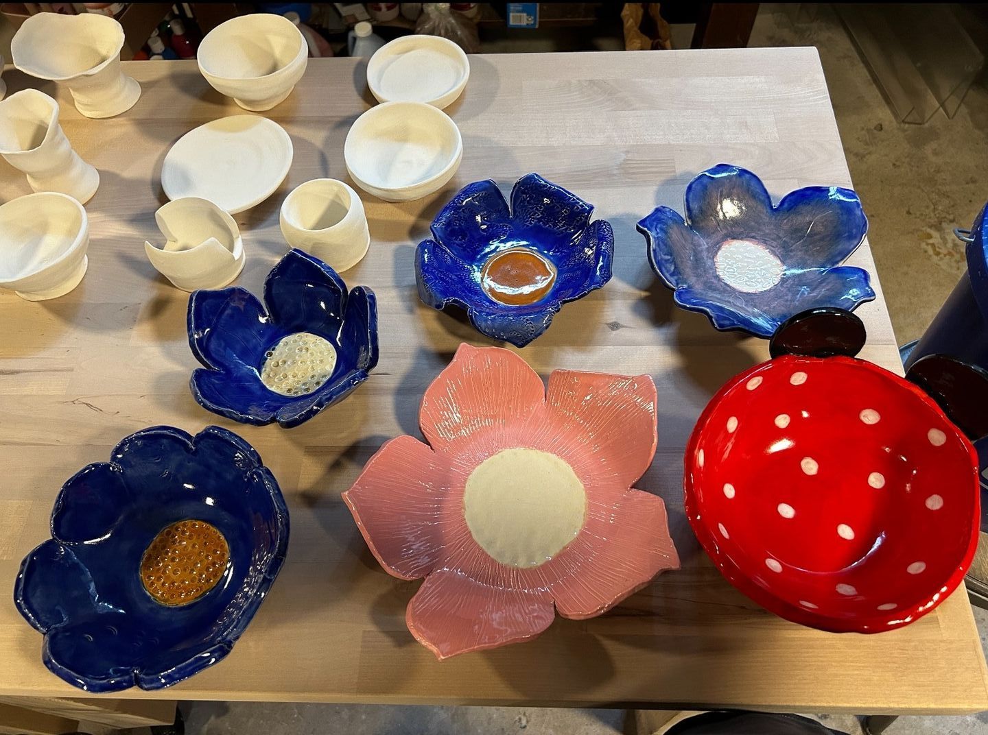 A person is making a pot on a pottery wheel