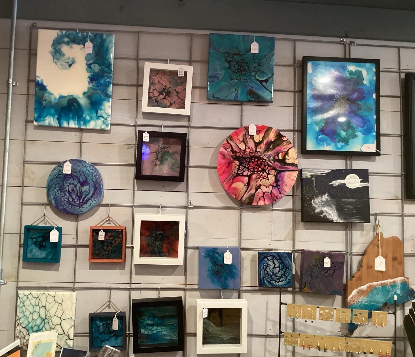 A wall with a lot of paintings on it