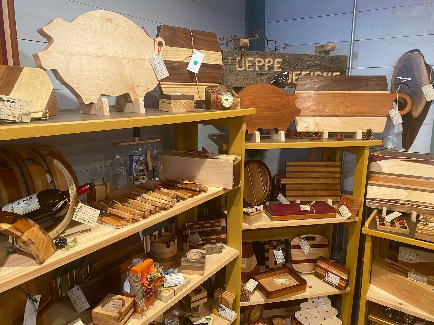 A store filled with lots of wooden items including cutting boards and boxes.