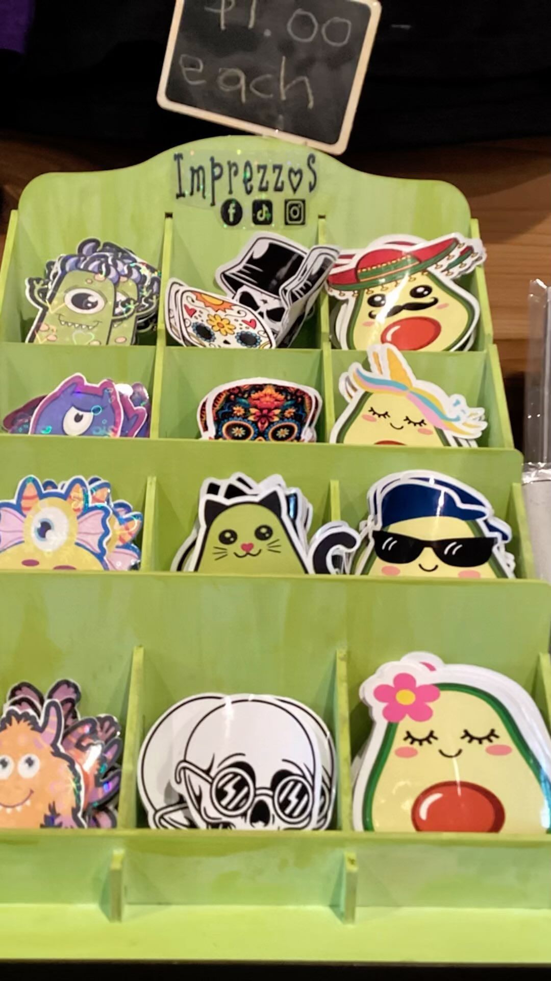 A display of stickers with a sign that says $ 1.00 each