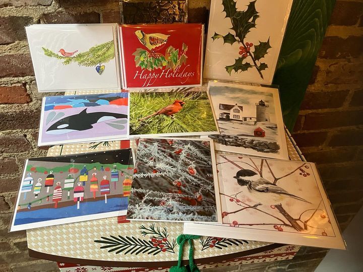 A bunch of christmas cards are sitting on a table