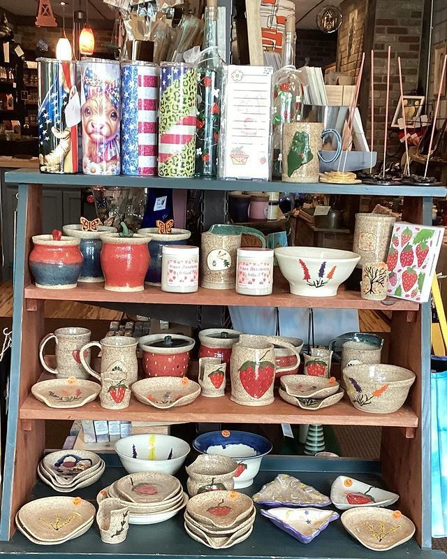 A shelf filled with lots of bowls and mugs