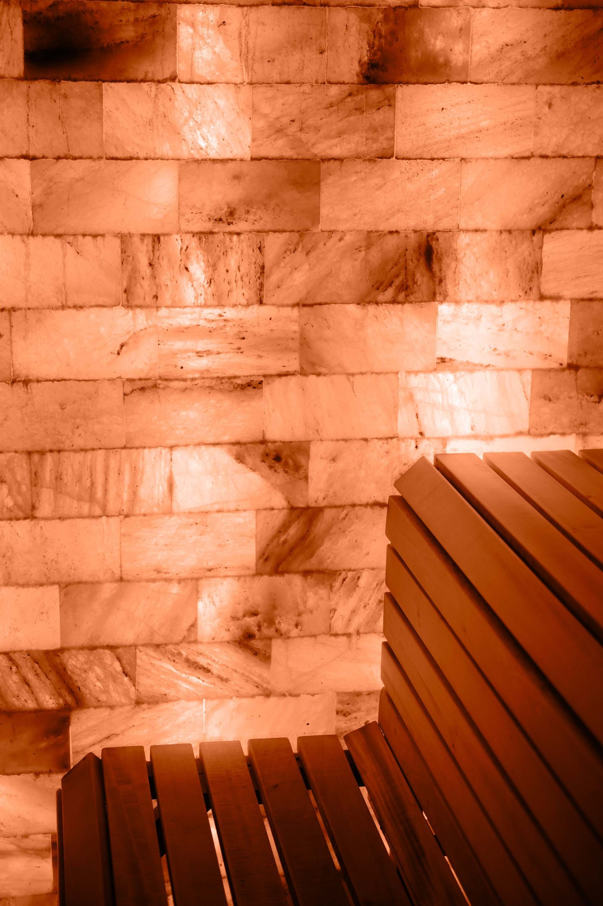 A wooden bench in salt room