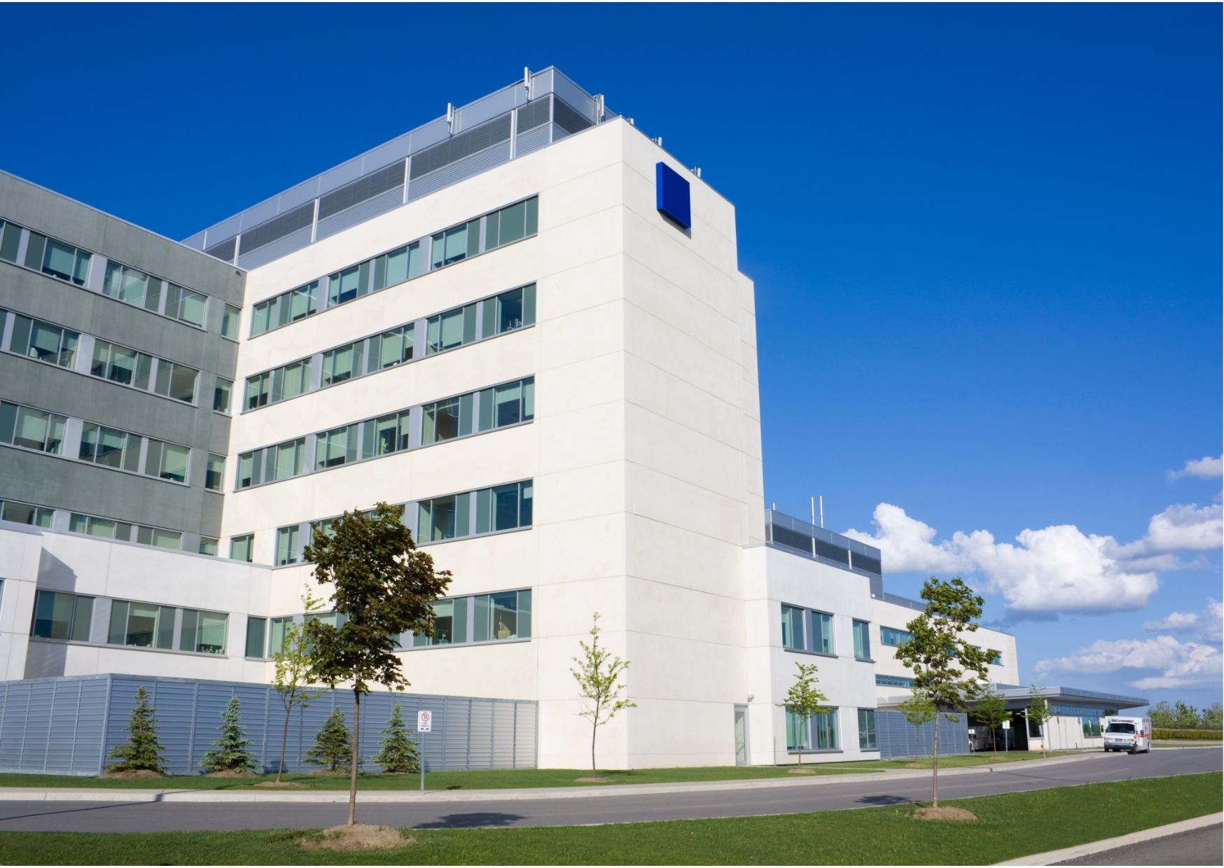 A doctor is writing on a clipboard while talking to a patient.