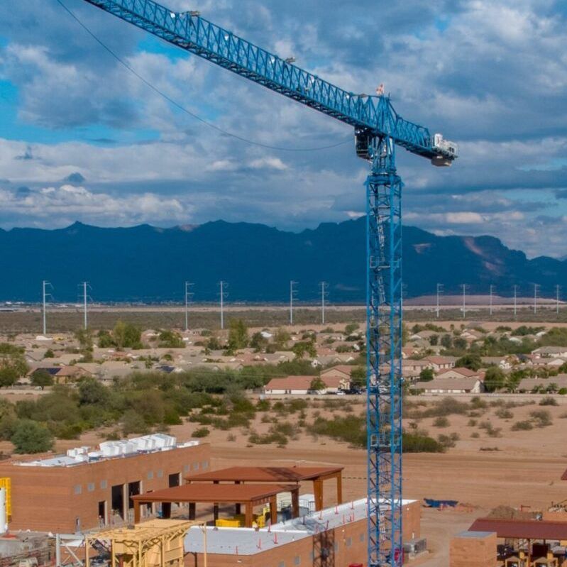 Photo by Phoenix Drone Pros, Robert Biggs, An aerial view of a construction site with a crane in the foreground