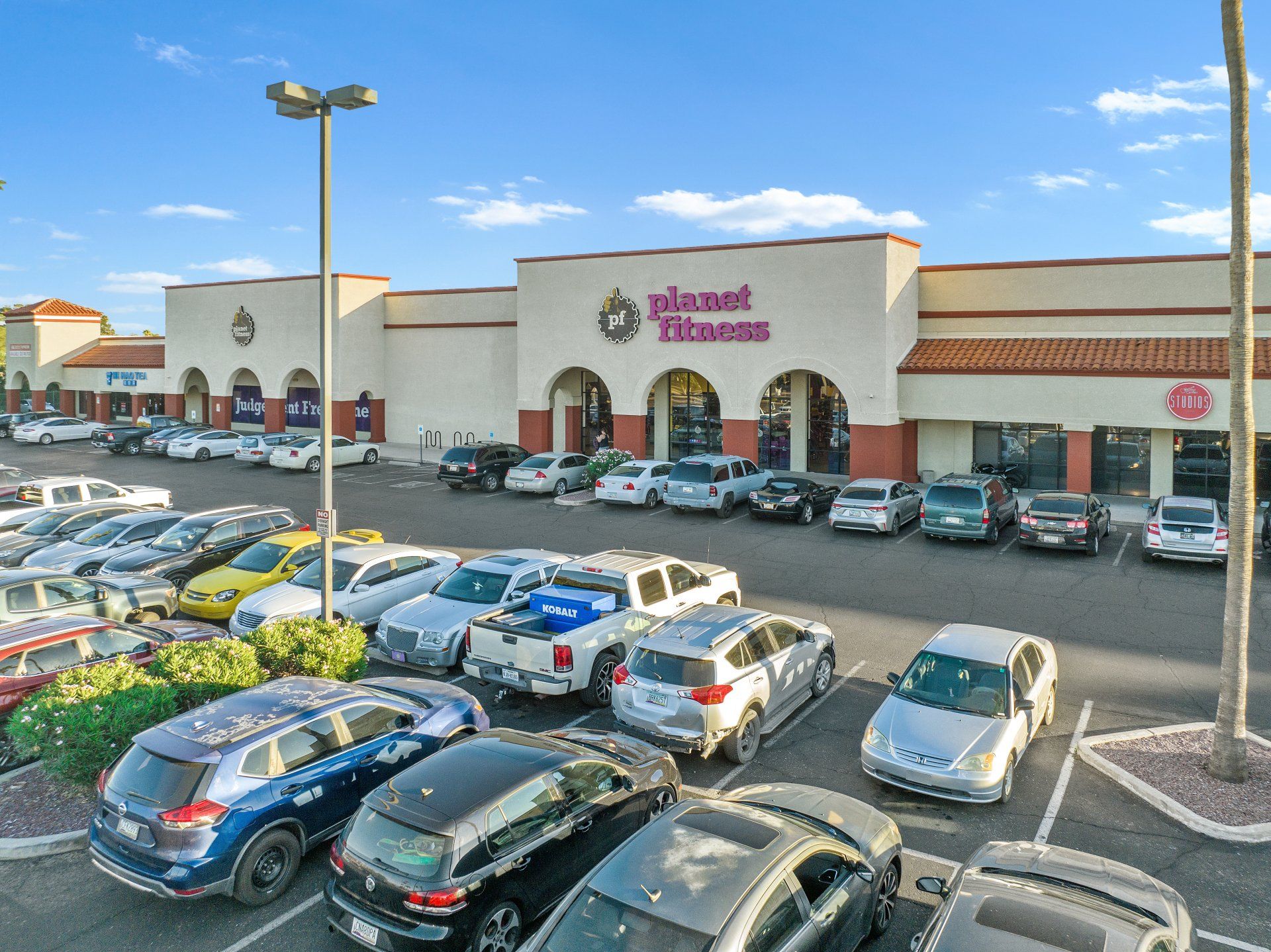 Photo by Phoenix Drone Pros, Robert Biggs, A lot of cars are parked in front of a store.