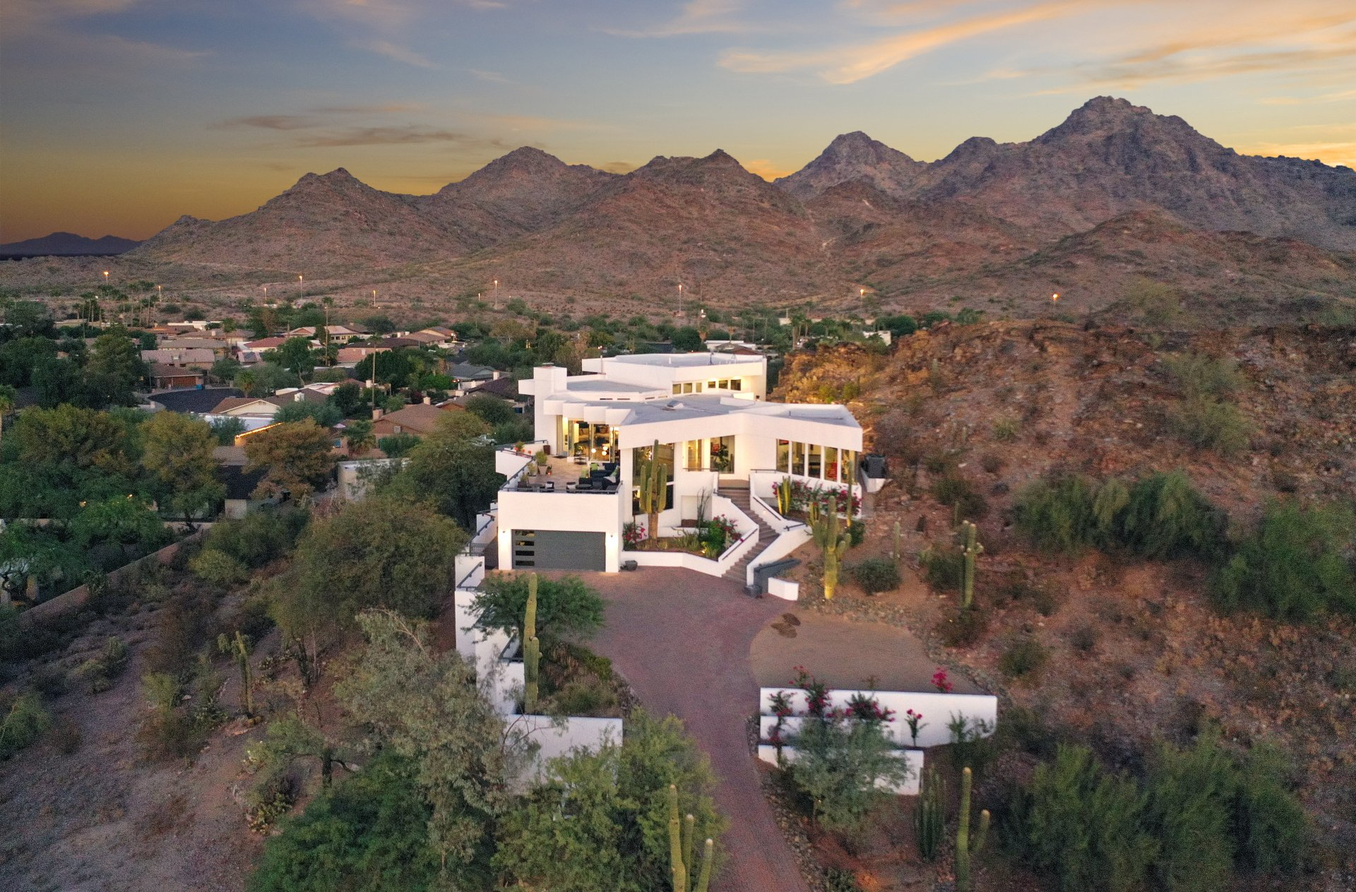 Photo by Phoenix Drone Pros, Robert Biggs, An aerial view of a large white house on top of a hill