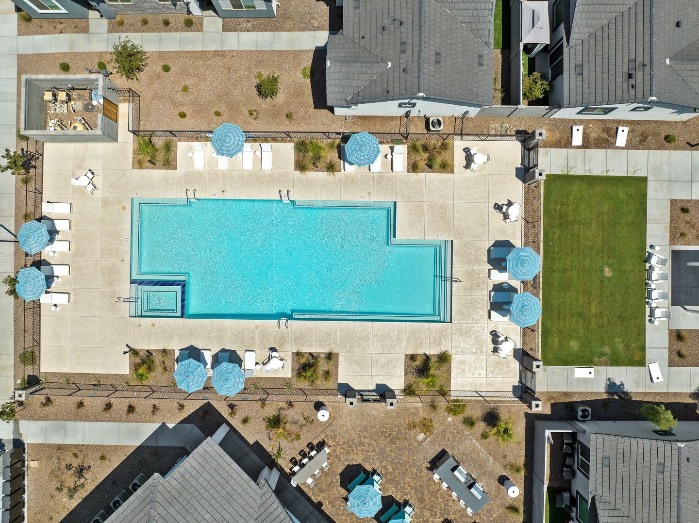 Photo by Phoenix Drone Pros, Robert Biggs, An aerial view of a large swimming pool surrounded by umbrellas