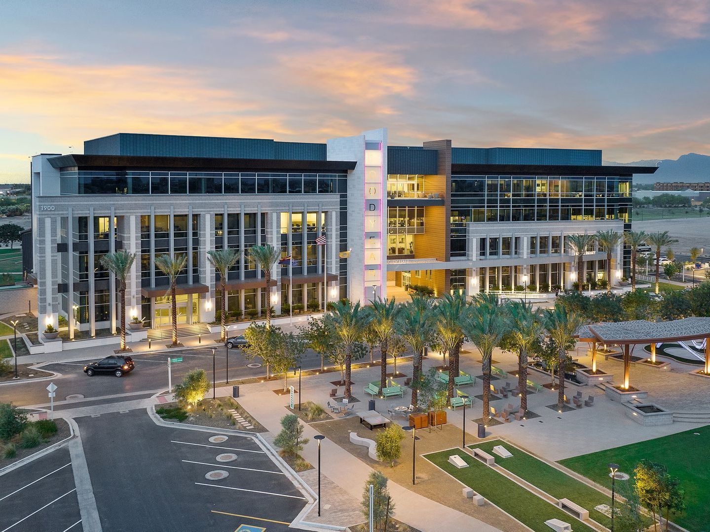 Photo by Phoenix Drone Pros, Robert Biggs, An aerial view of a large building with palm trees in front of it.