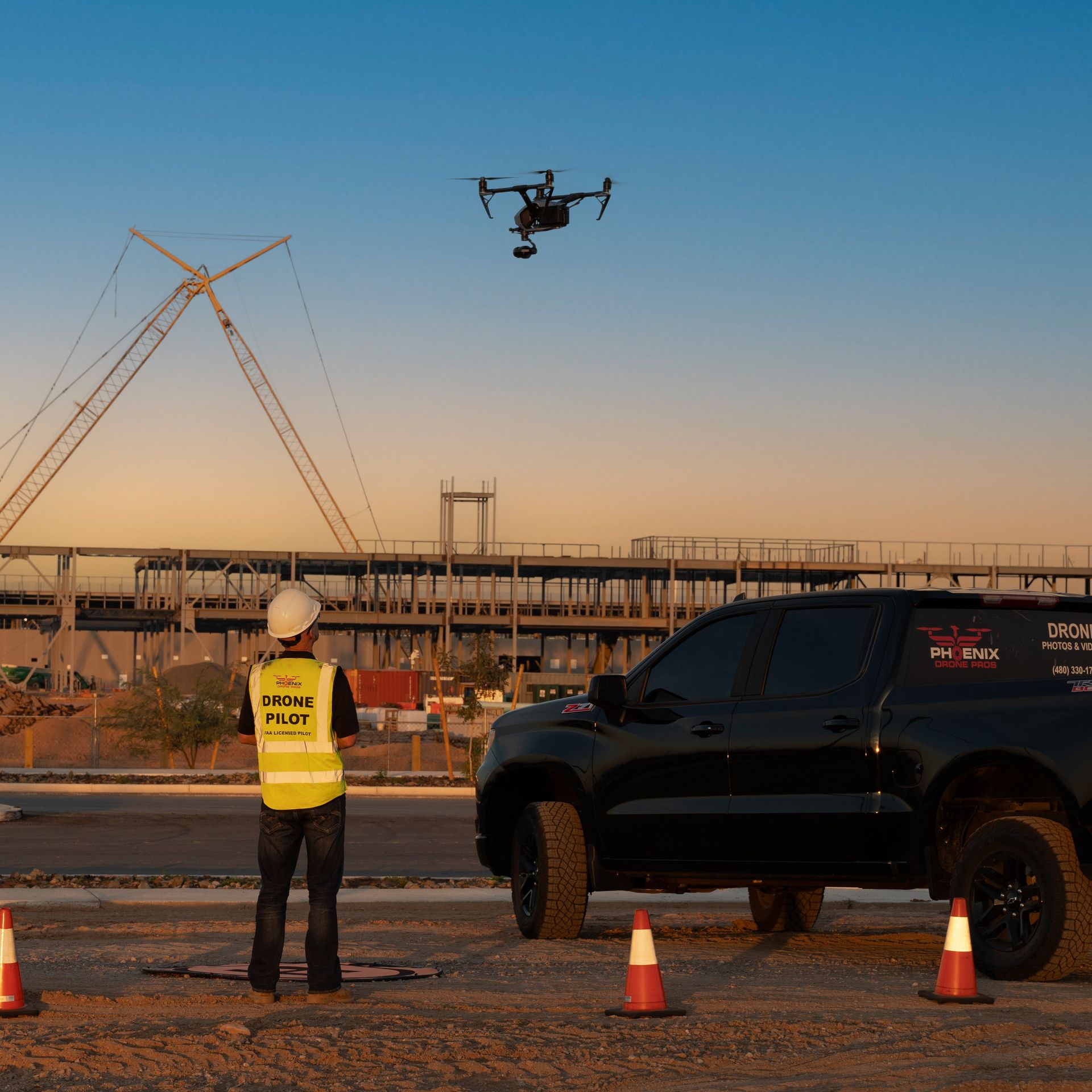 Photo by Phoenix Drone Pros, Robert Biggs, A man in a yellow vest with the word pilot on it