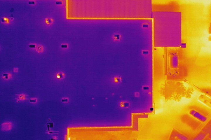 An aerial view of a building with a thermal image of the ceiling.