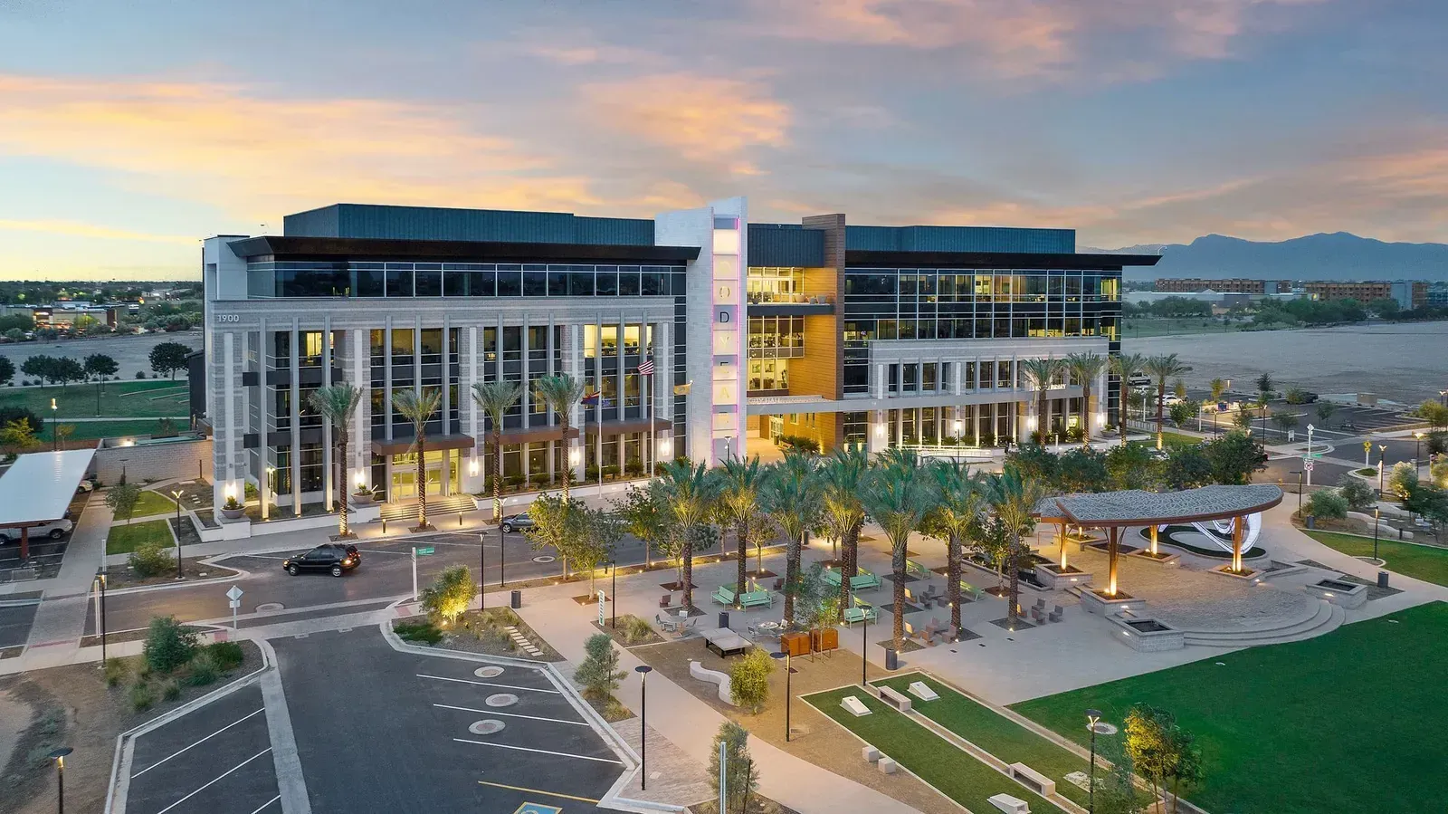 Photo by Phoenix Drone Pros, Robert Biggs, An aerial view of a large building with palm trees in front of it.