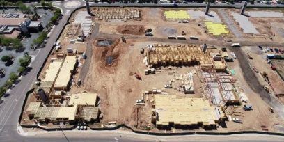 An aerial view of a construction site with a lot of buildings under construction