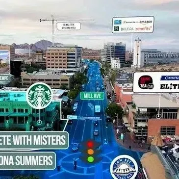 Photo by Phoenix Drone Pros, Robert Biggs, An aerial view of a city street with signs for starbucks and misters