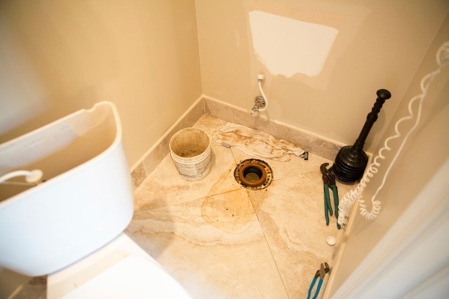 Contaminated water from a sewage backup pooling on a bathroom floor in a Largo, FL home