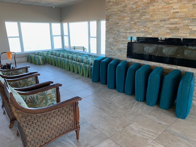 Commercial upholstery cleaning inside a Florida clubhouse after hurricane restoration construction