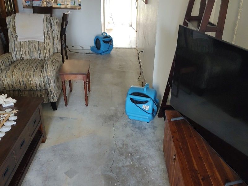 Damaged laminate flooring removed and ready for disposal