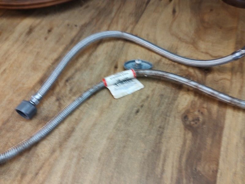 Supply line to bathroom sink showing the leak source