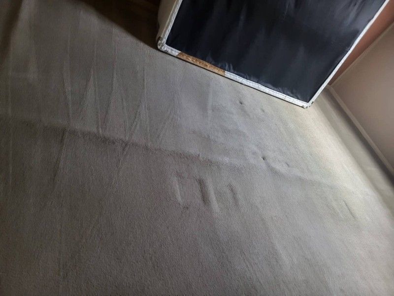 Carpet corner showing damage before cleaning