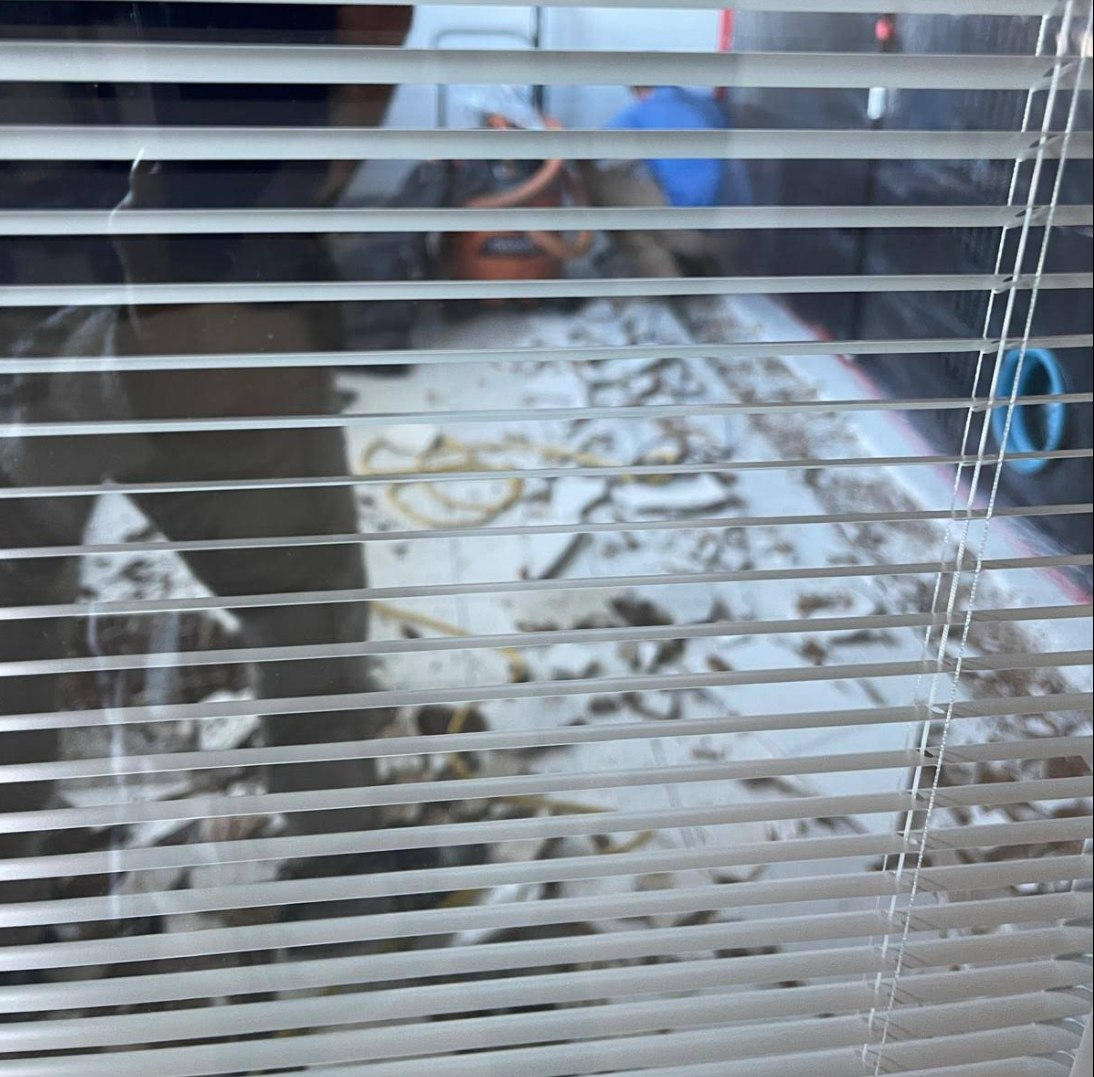 Industrial drying equipment positioned over exposed concrete slab