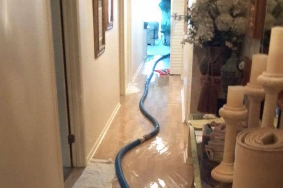 Professional express water removal equipment set up in a flooded Florida home