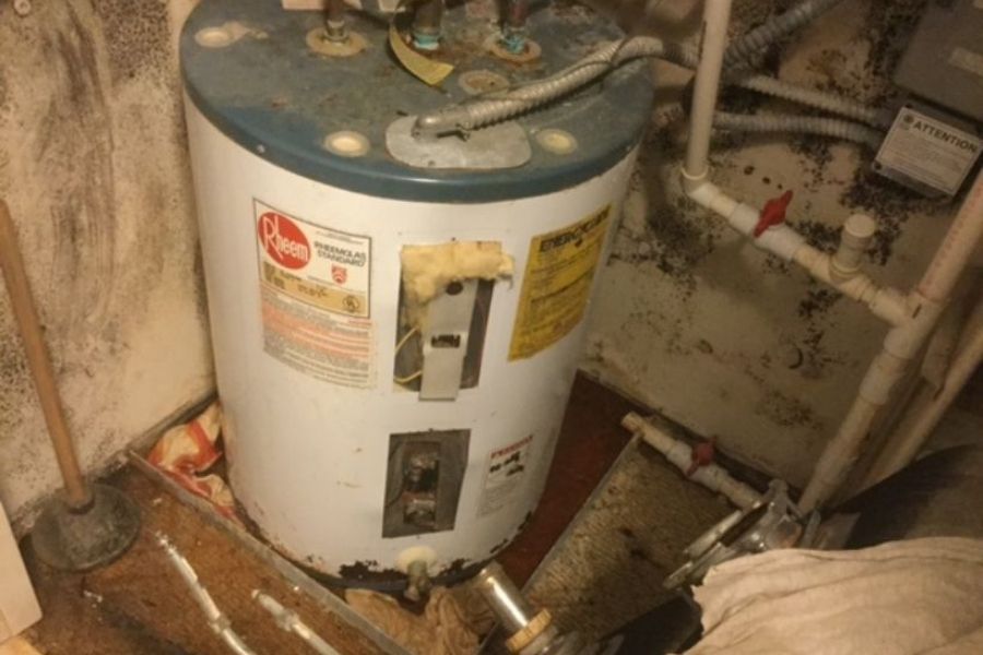 Mold growth around water heater area from prolonged moisture