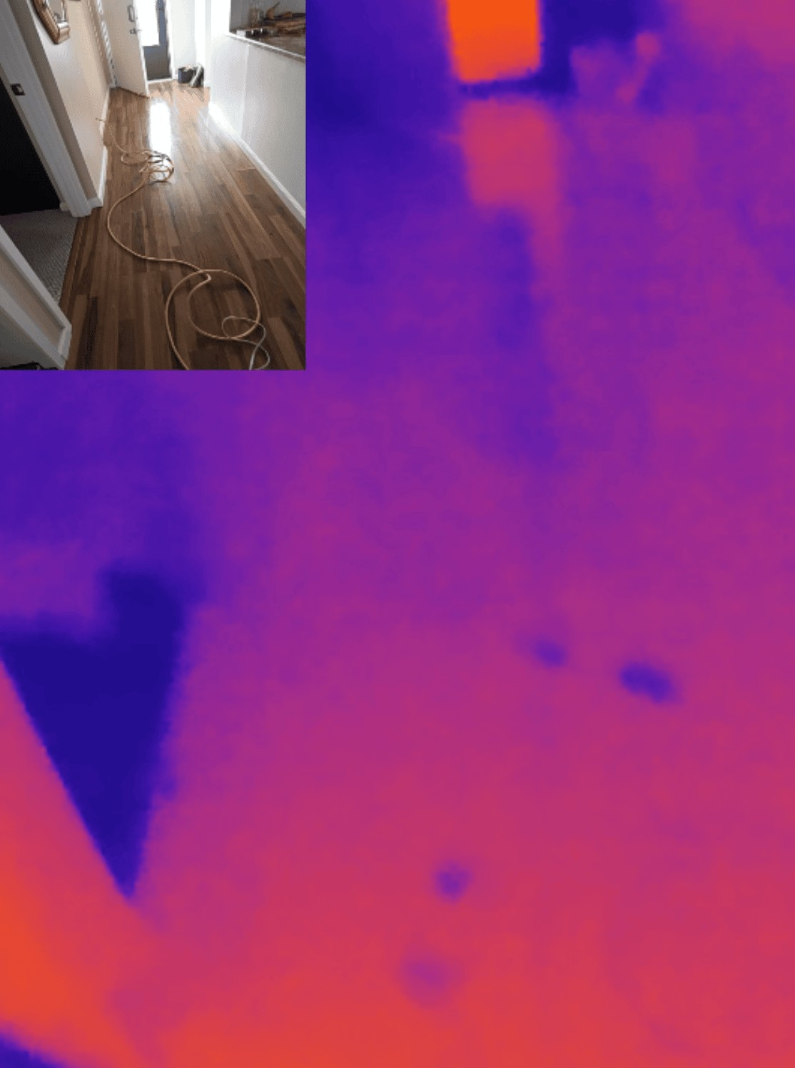 Infrared camera detecting moisture in hallway walls