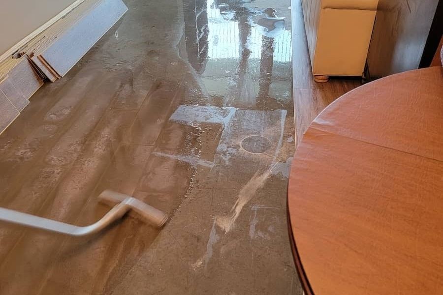 Urgent water extraction in progress at a flooded Tampa Bay home