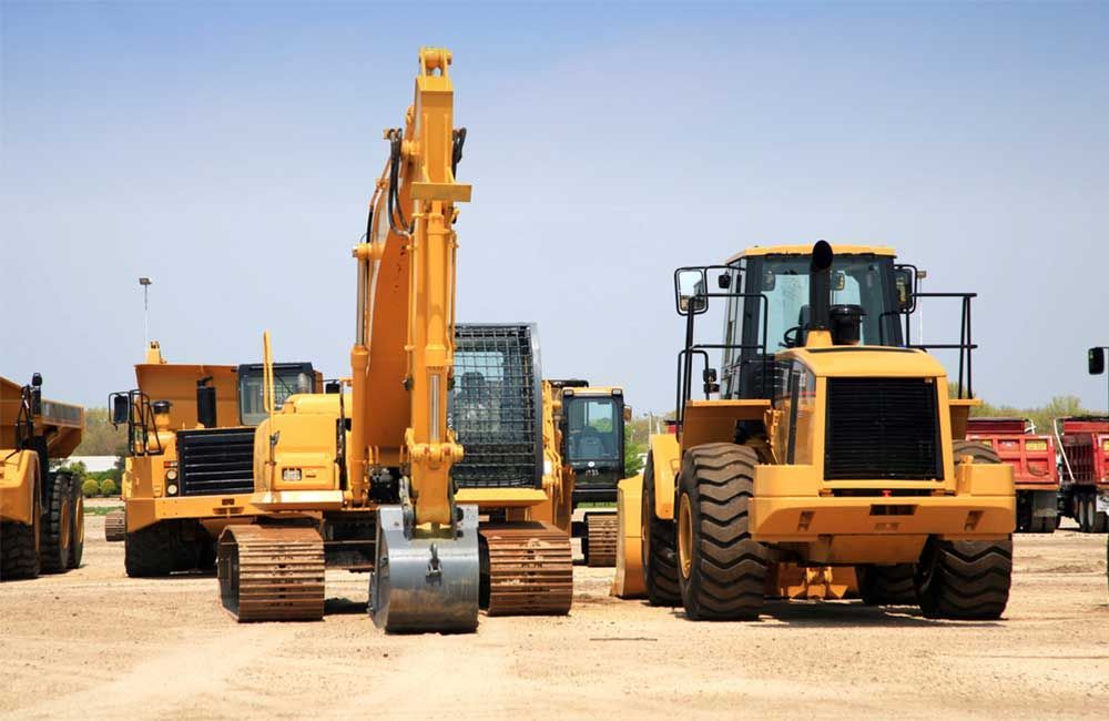Yellow Construction Equipment Parked in a Lot — Huntlys Heavy Equipment in Yeppoon, QLD