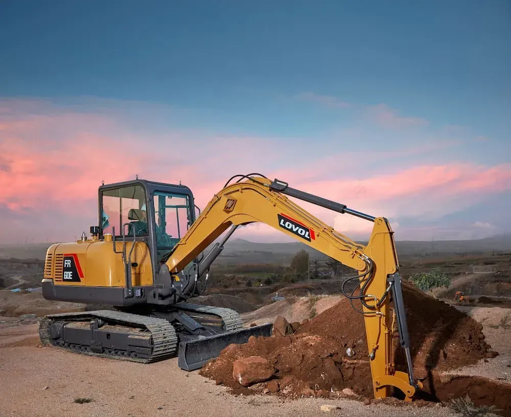 Yellow Excavator Digging in Dirt — Huntlys Heavy Equipment In Gracemere, QLD