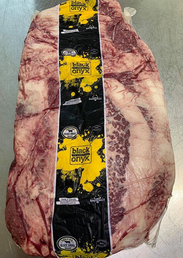 A Large Piece of Meat is Wrapped in Plastic — Midway Butchers in South Innisfail, QLD