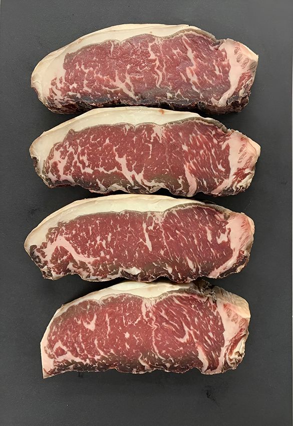 Four Steaks Are Stacked on Top of Each Other — Midway Butchers in South Innisfail, QLD