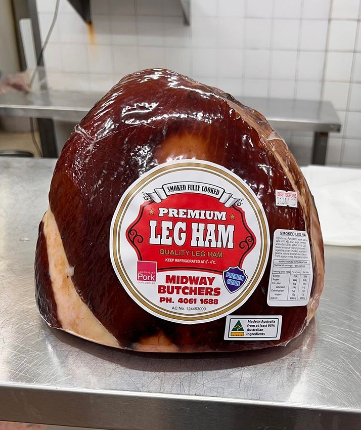 A Large Piece of Leg Ham on a Metal Table — Midway Butchers in South Innisfail, QLD