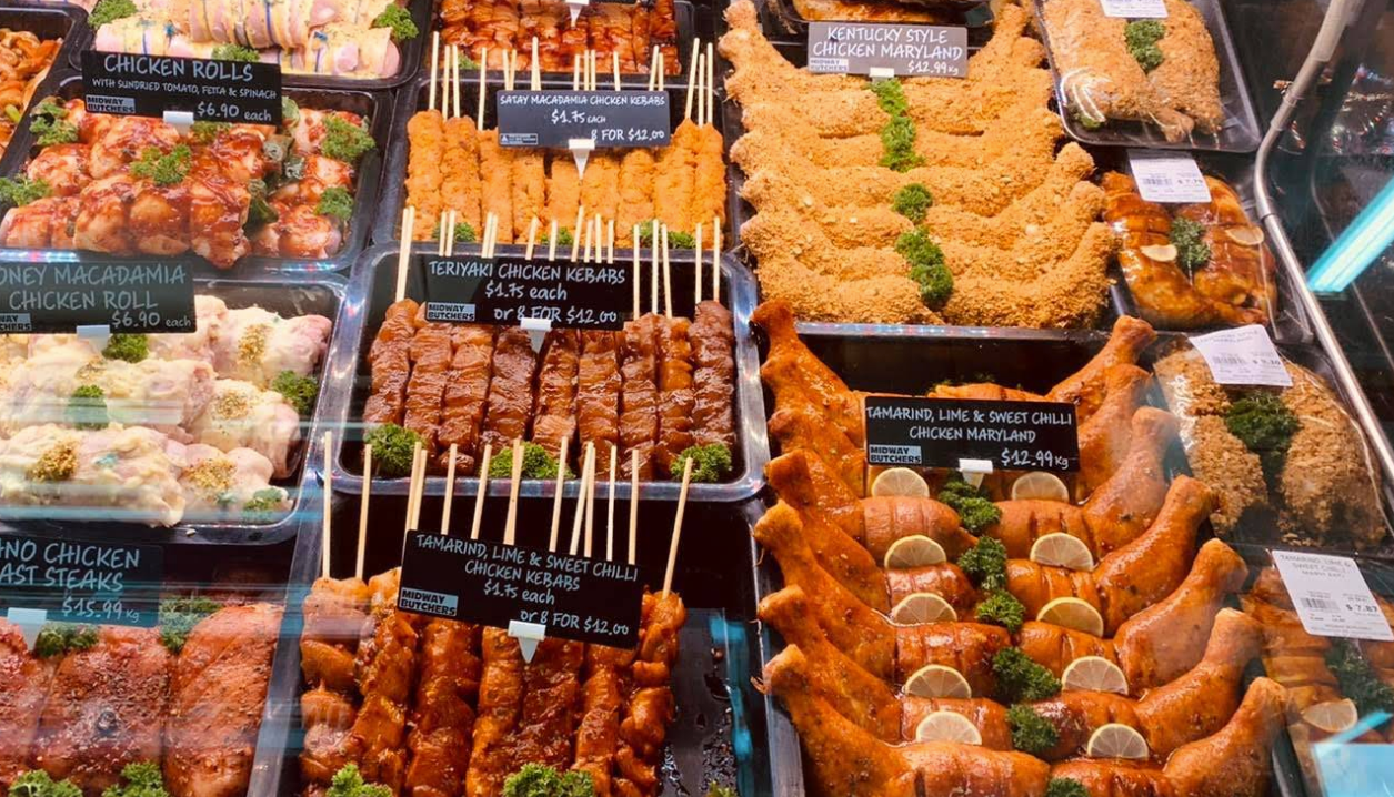 Trays with different types of meat including signs — Midway Butchers in South Innisfail, QLD