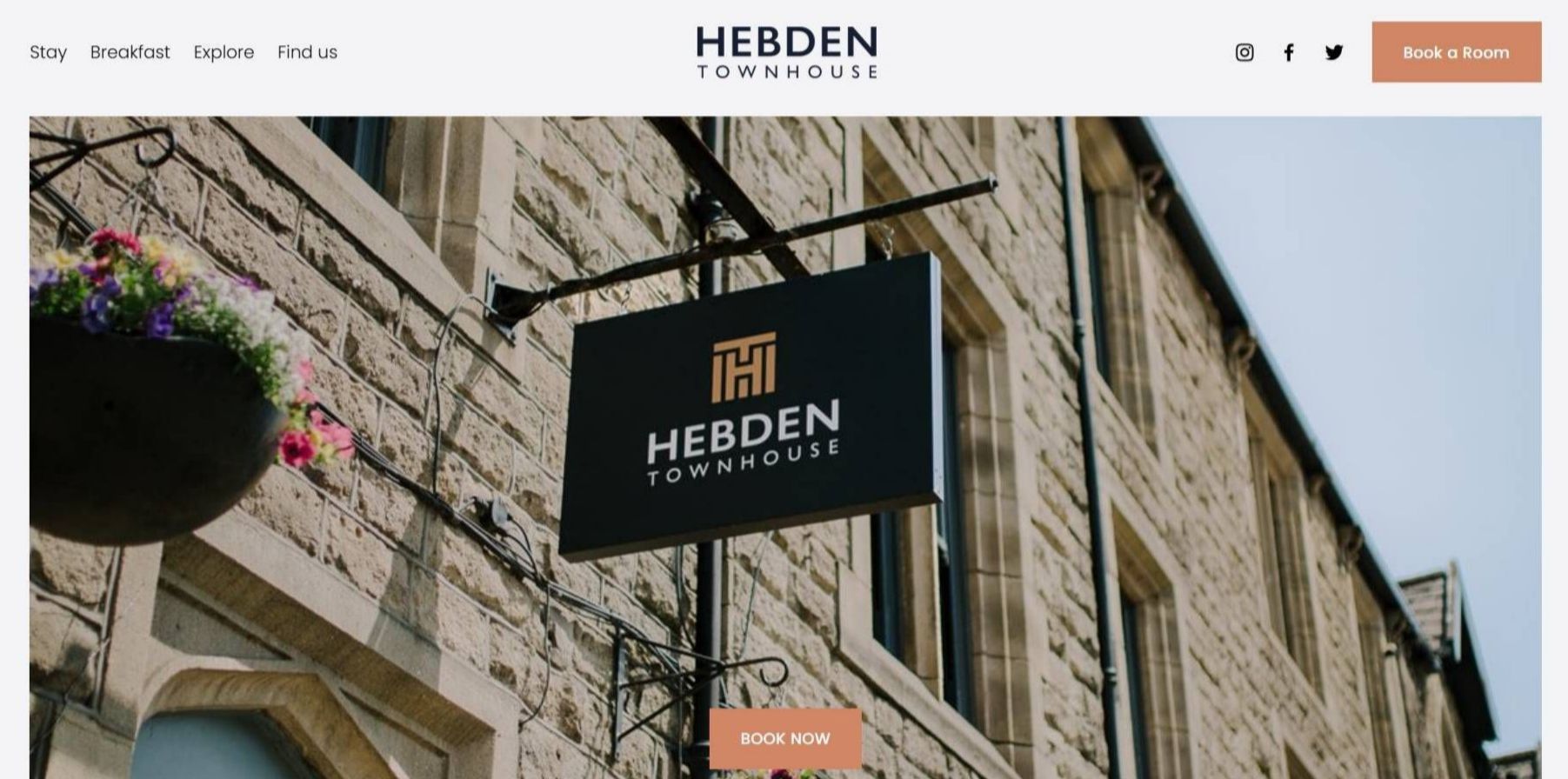 A picture of a building with a sign on the side of it.