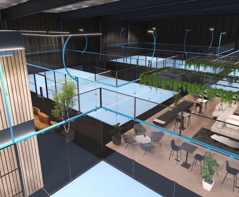 A CGI aerial view of a room of the new Padel Shed Club, showing the courts and seating area with tables and chairs