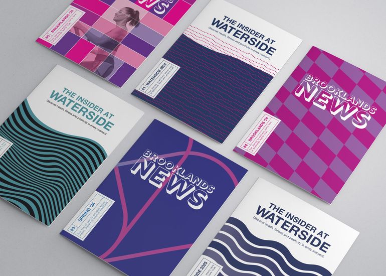 A display of brochures with one that says ' the insider at waterside ' on it, another says Brooklands News