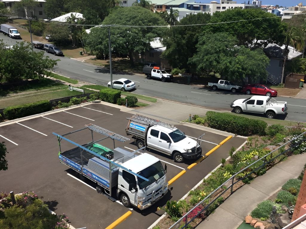 A Group of Trucks Are Parked in a Parking Lot — Roofing Revamped In Maroochydore, QLD
