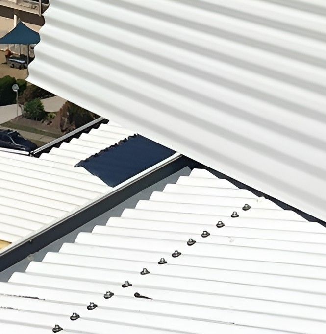 A White Roof With a Lot of Screws on It — Roofing Revamped in Marcoola, QLD