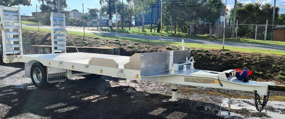 A White Trailer Is Parked On The Side Of The Road — Eddies Trailers & Fab in Muswellbrook, NSW