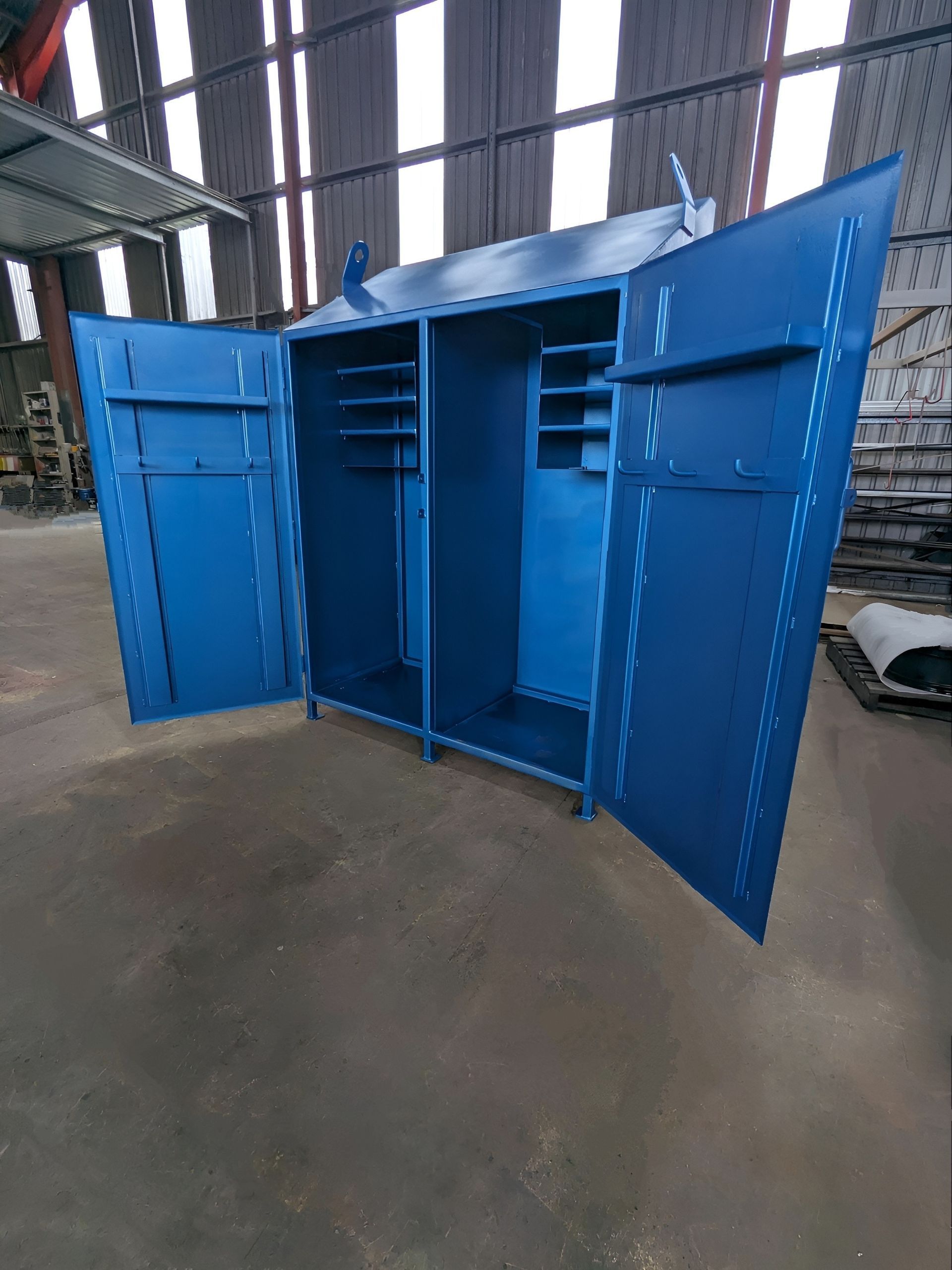 A Blue Cupboard In Warehouse With Doors Open — Eddies Trailers & Fab in Muswellbrook, NSW