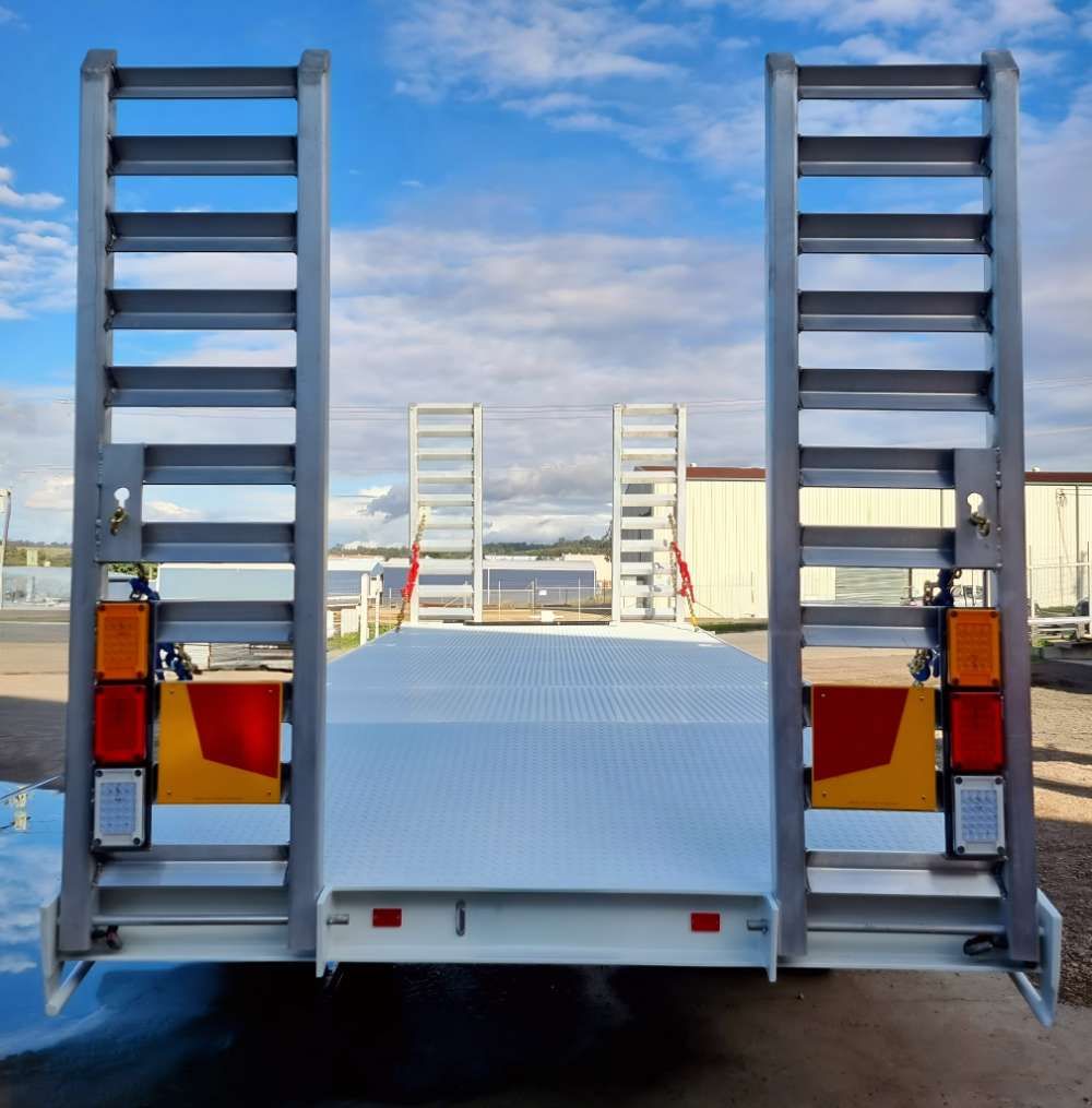 The Back Of A Trailer With Stairs On It Is Parked In A Parking Lot — Eddies Trailers & Fab in Muswellbrook, NSW