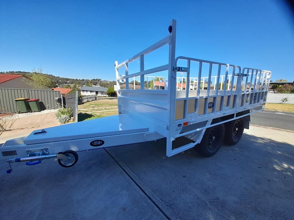 A White Trailer Is Parked On The Side Of The Road — Eddies Trailers & Fab in Muswellbrook, NSW