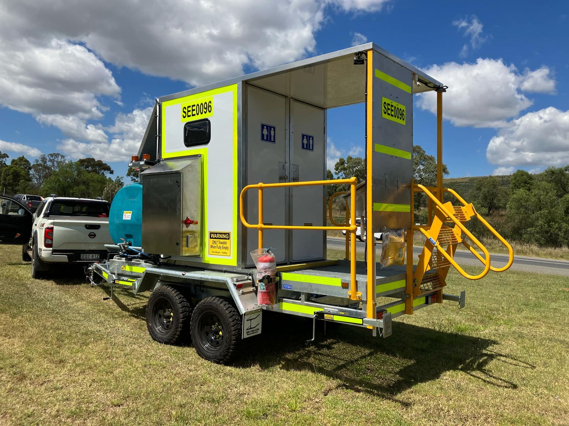 A Large White Machine Is Sitting in A Warehouse — Eddies Trailers & Fab in Muswellbrook, NSW