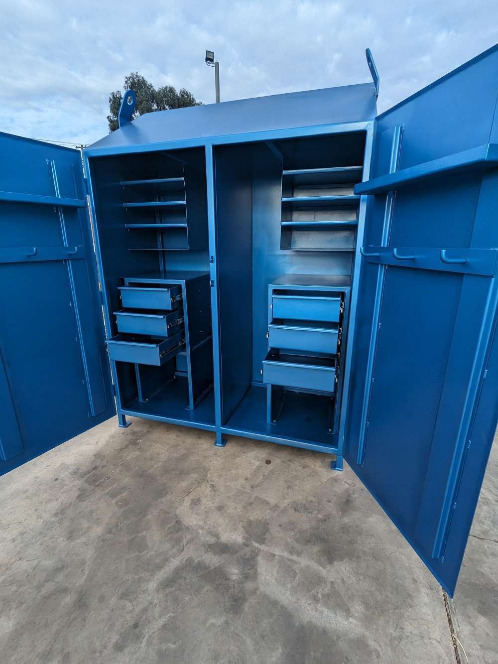 A Blue Cabinet With The Doors Open And Drawers — Eddies Trailers & Fab in Muswellbrook, NSW