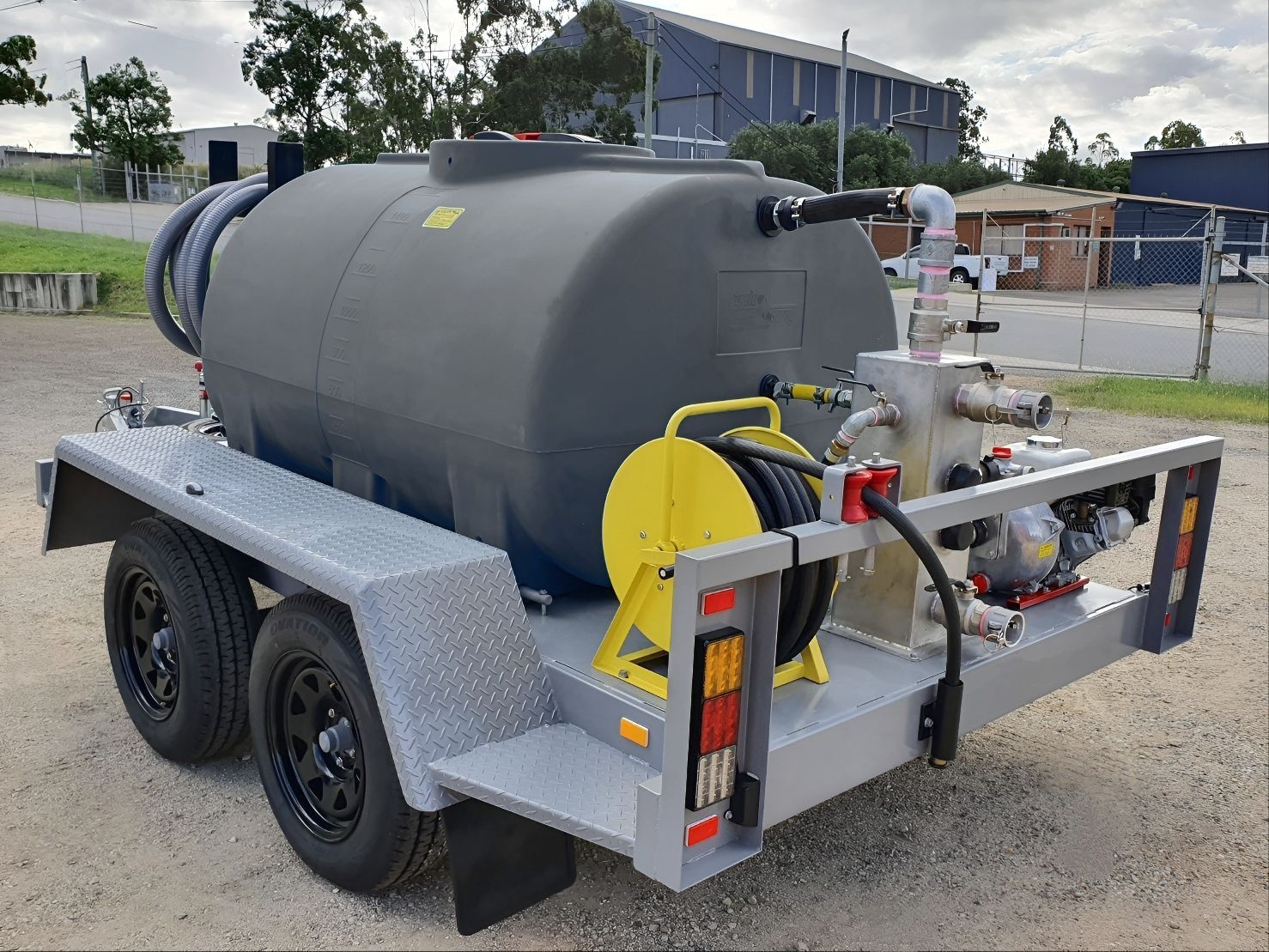A Trailer with A Large Tank and A Pump Attached to It — Eddies Trailers & Fab in Muswellbrook, NSW