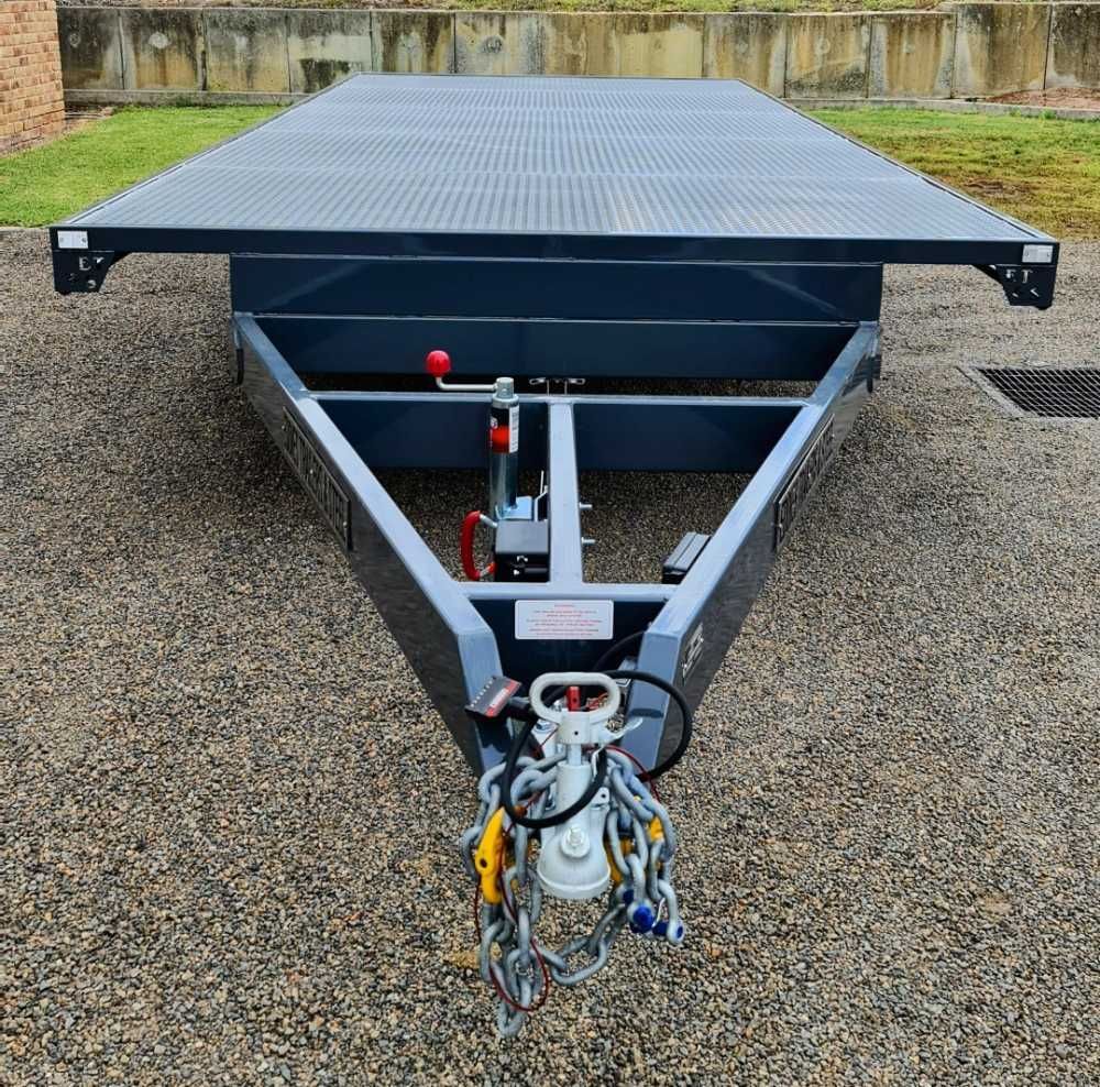 A Large Trailer Is Parked In A Gravel Lot — Eddies Trailers & Fab in Muswellbrook, NSW