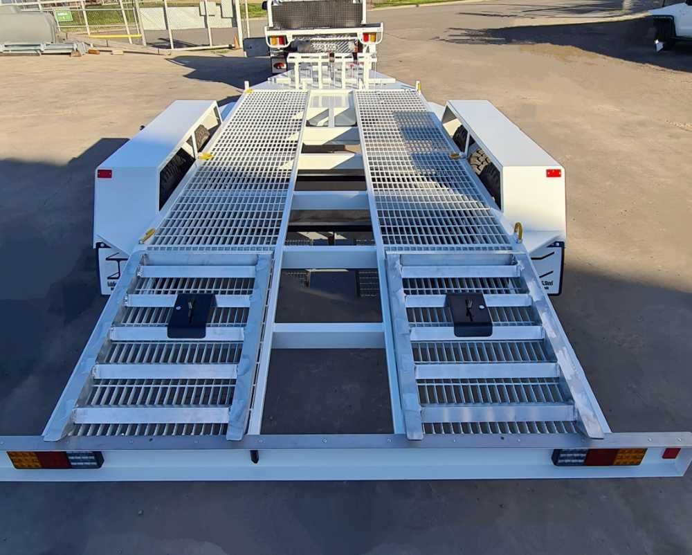 A White Trailer With A Ladder On The Back Is Parked In A Parking Lot — Eddies Trailers & Fab in Muswellbrook, NSW