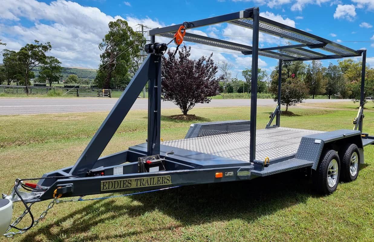 A Trailer Is Sitting on Top of A Lush Green Field — Eddies Trailers & Fab in Muswellbrook, NSW